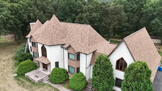 Aerial view of a well-maintained roof on a large residential home