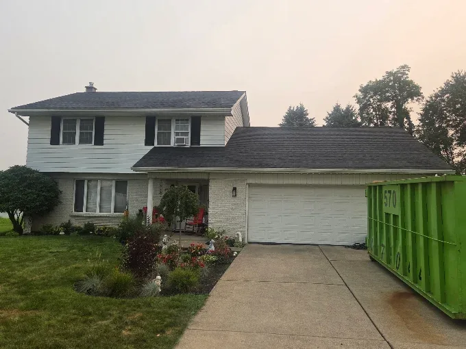Exterior siding project underway on a split-level home