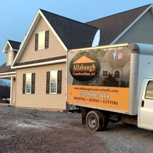 Allabaugh Construction box truck parked at a residential roofing job