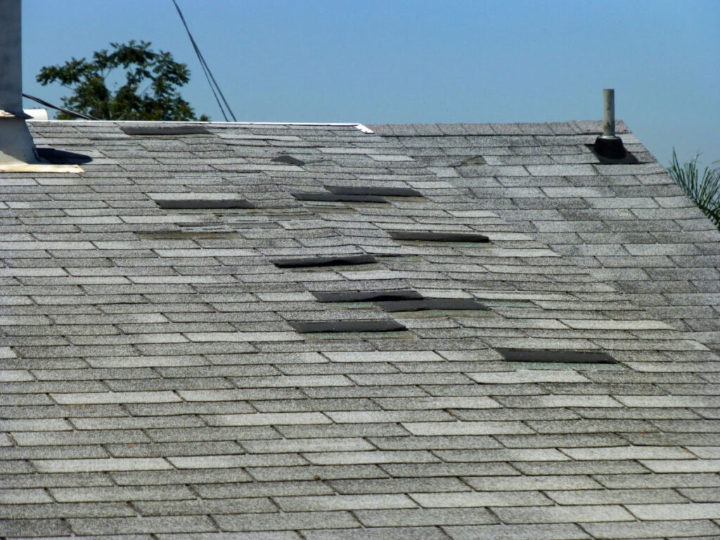 Multiple asphalt shingles coming loose on a home's roof
